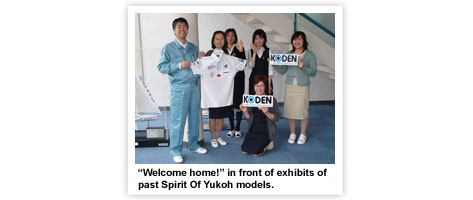  Welcome home! in front of exhibits of past Spirit Of Yukoh models.